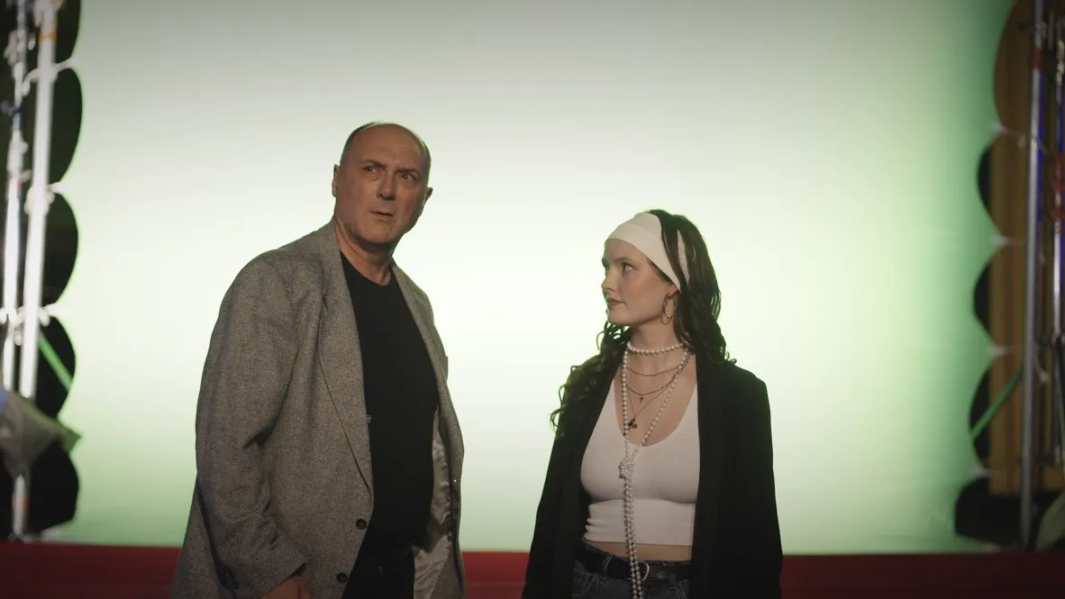 Ben and Freya before the glowing screen