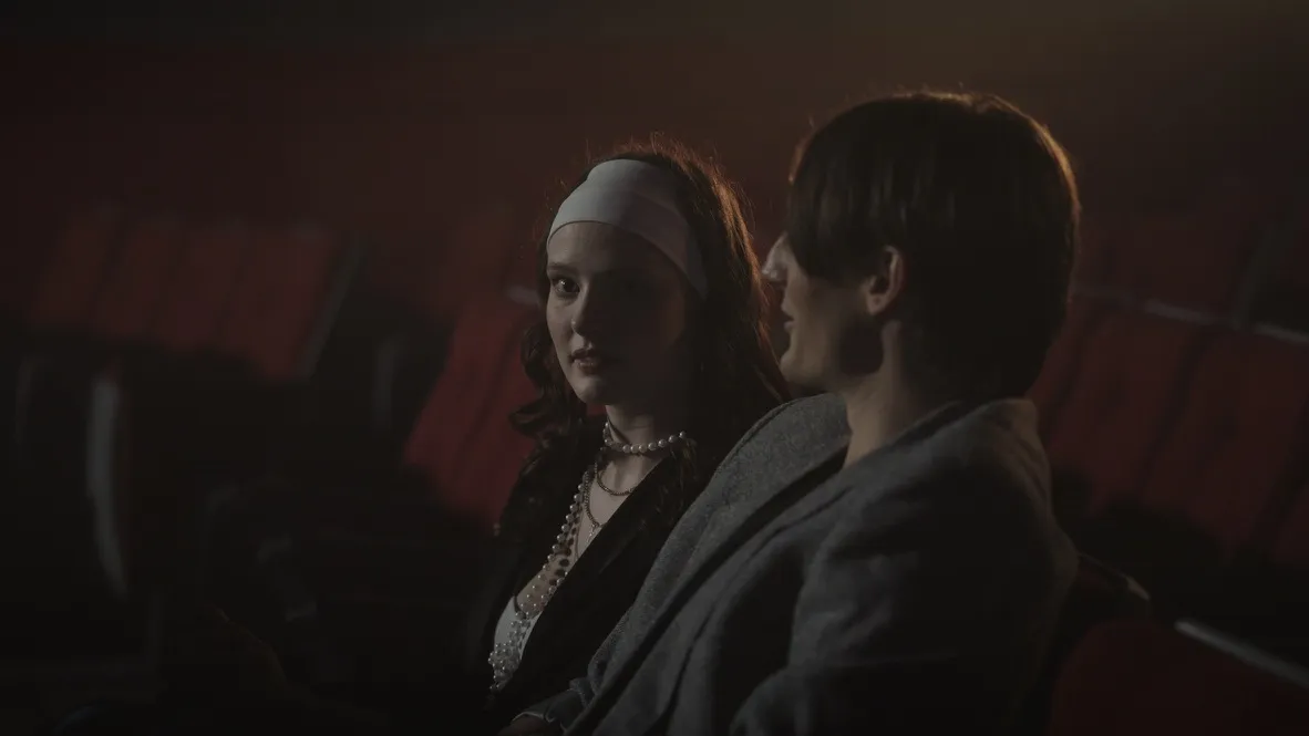 Ben and Freya side by side in the theatre seats