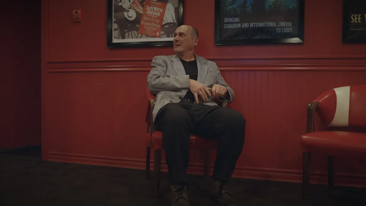 Ben waits in the red lobby of the Salmar Classic